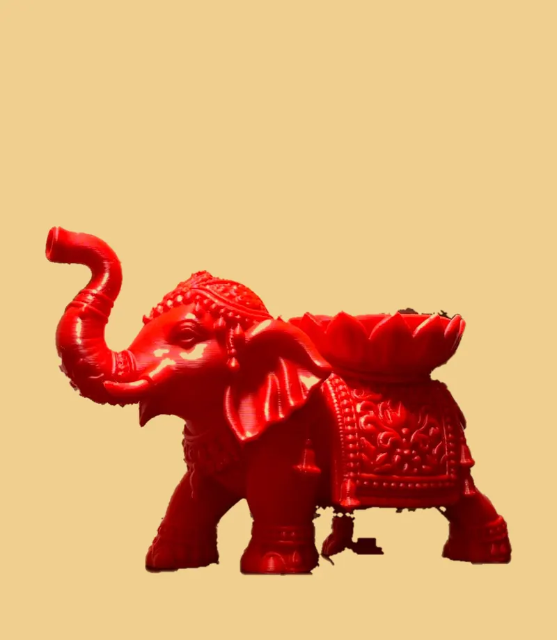 Red elephant diya holder with a lotus bowl on its back